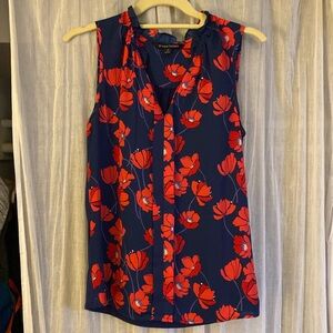 Sleeveless floral blouse with navy solid back